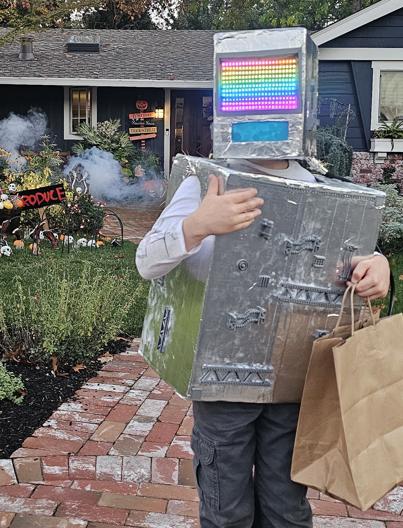 The finished costume on Halloween night, the LED panel running the rainbow animation